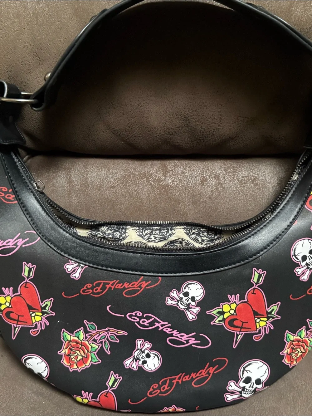 Signature Ed Hardy tattoo print Shoulder Bag with Skull, Rose & Pink accents.